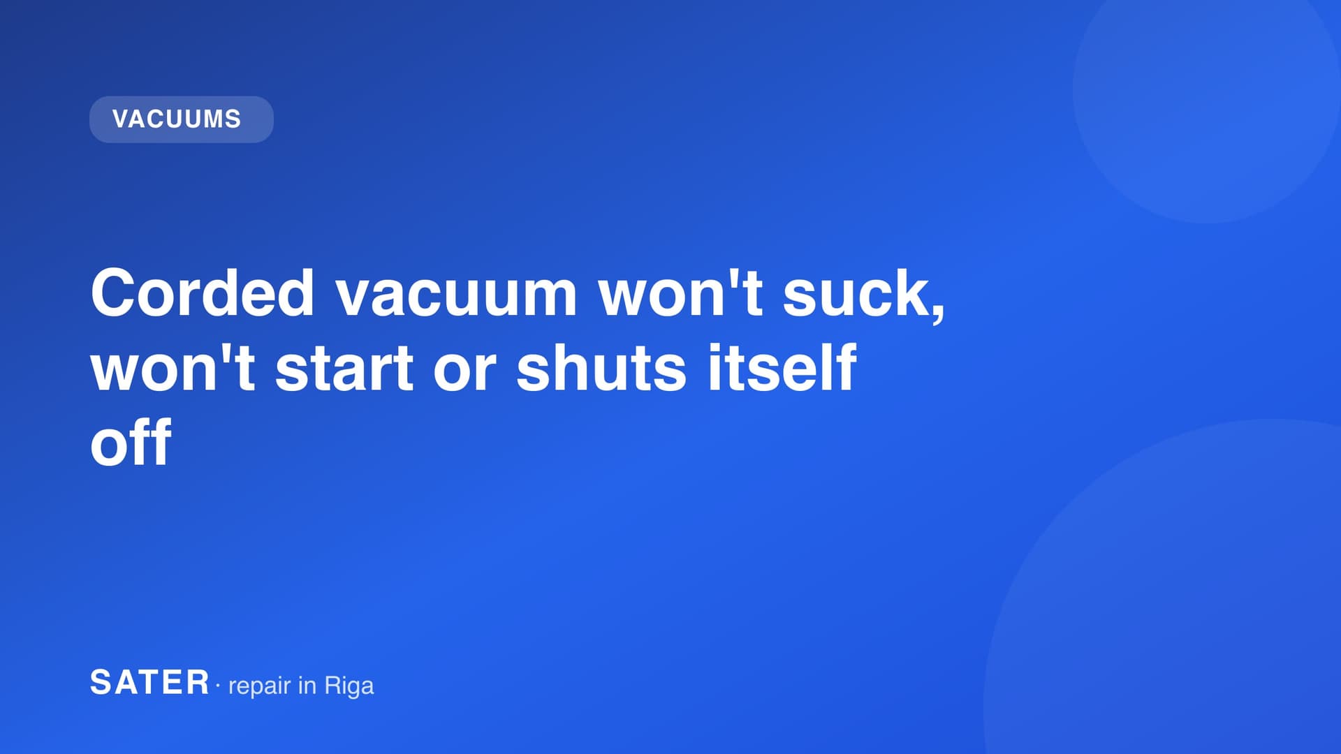 Man cleaning a floor with a corded cylinder vacuum in an apartment