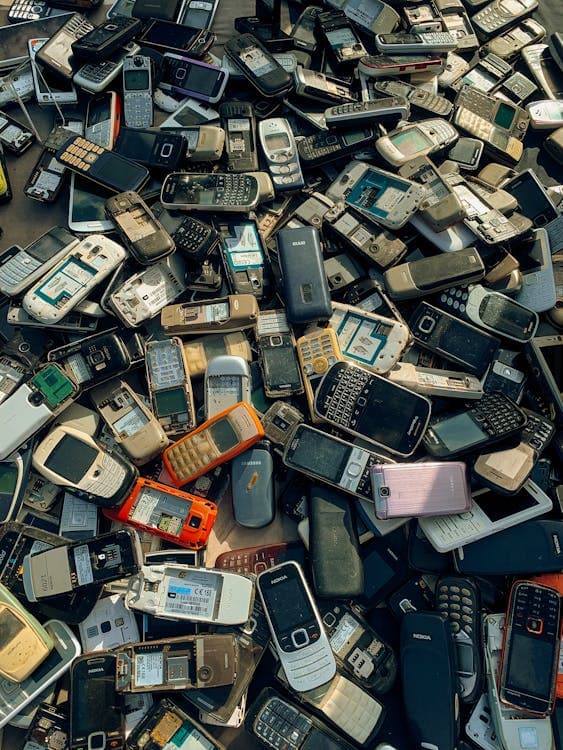 Pile of obsolete smartphones collected for electronic waste recycling