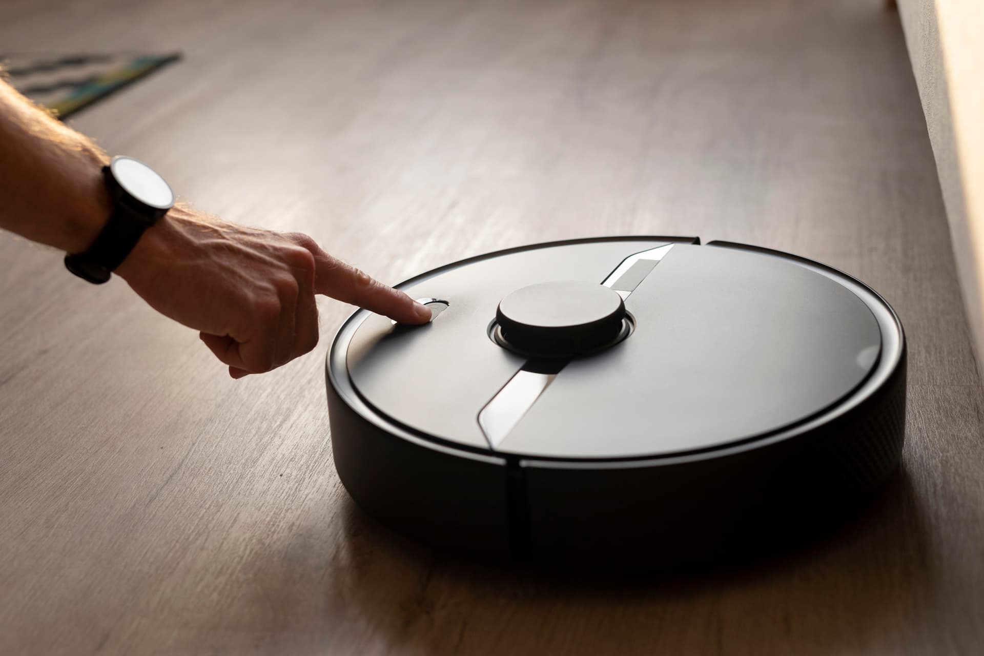 iRobot Roomba robot vacuum cleaner on hardwood floor