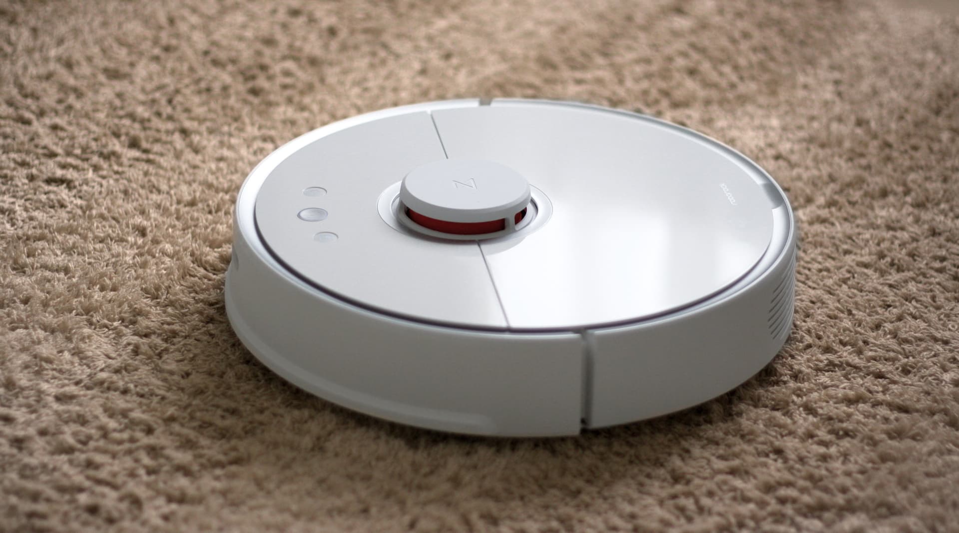 iRobot Roomba robot vacuum cleaner on hardwood floor