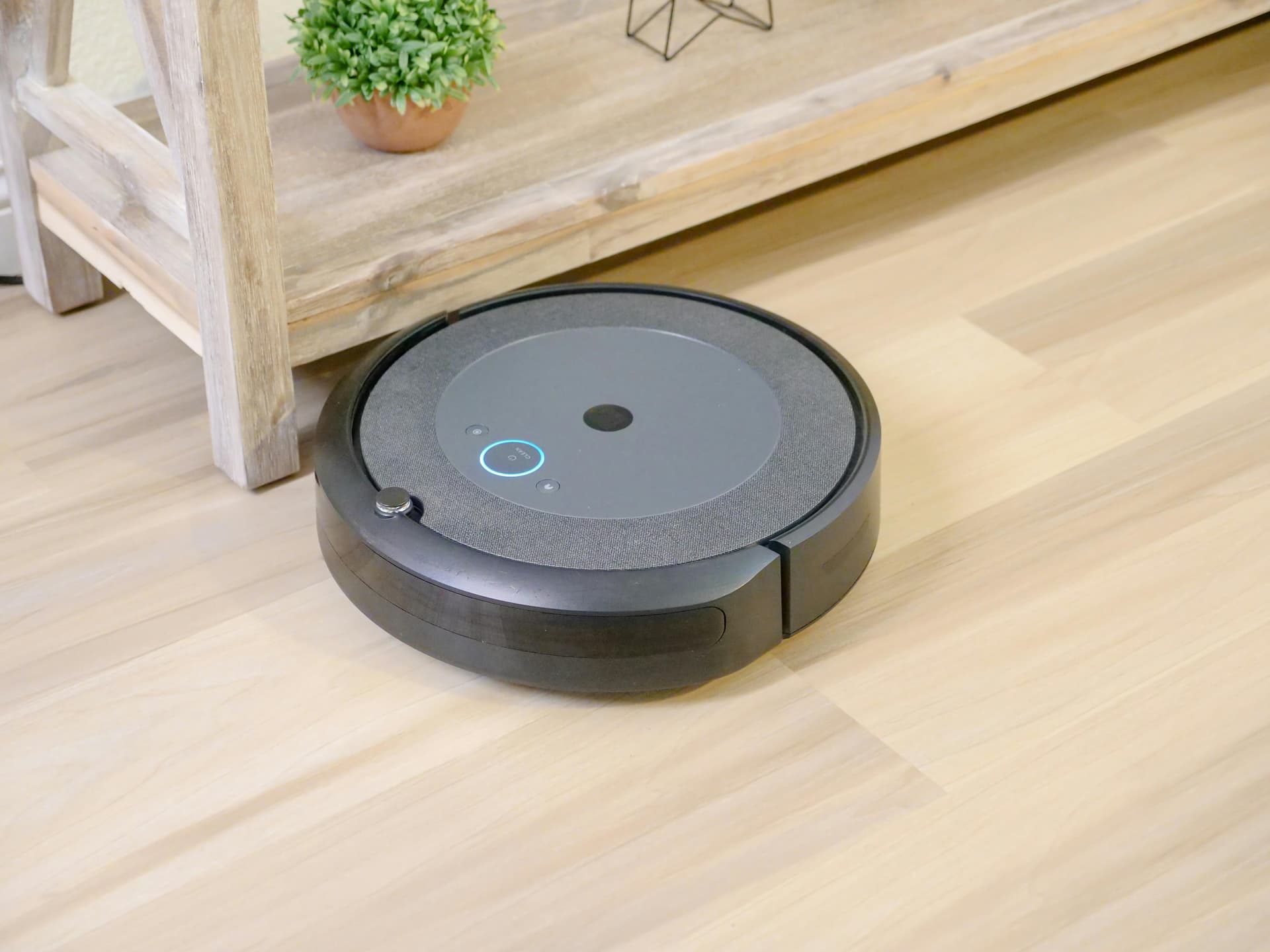 iRobot Roomba robot vacuum cleaner on hardwood floor