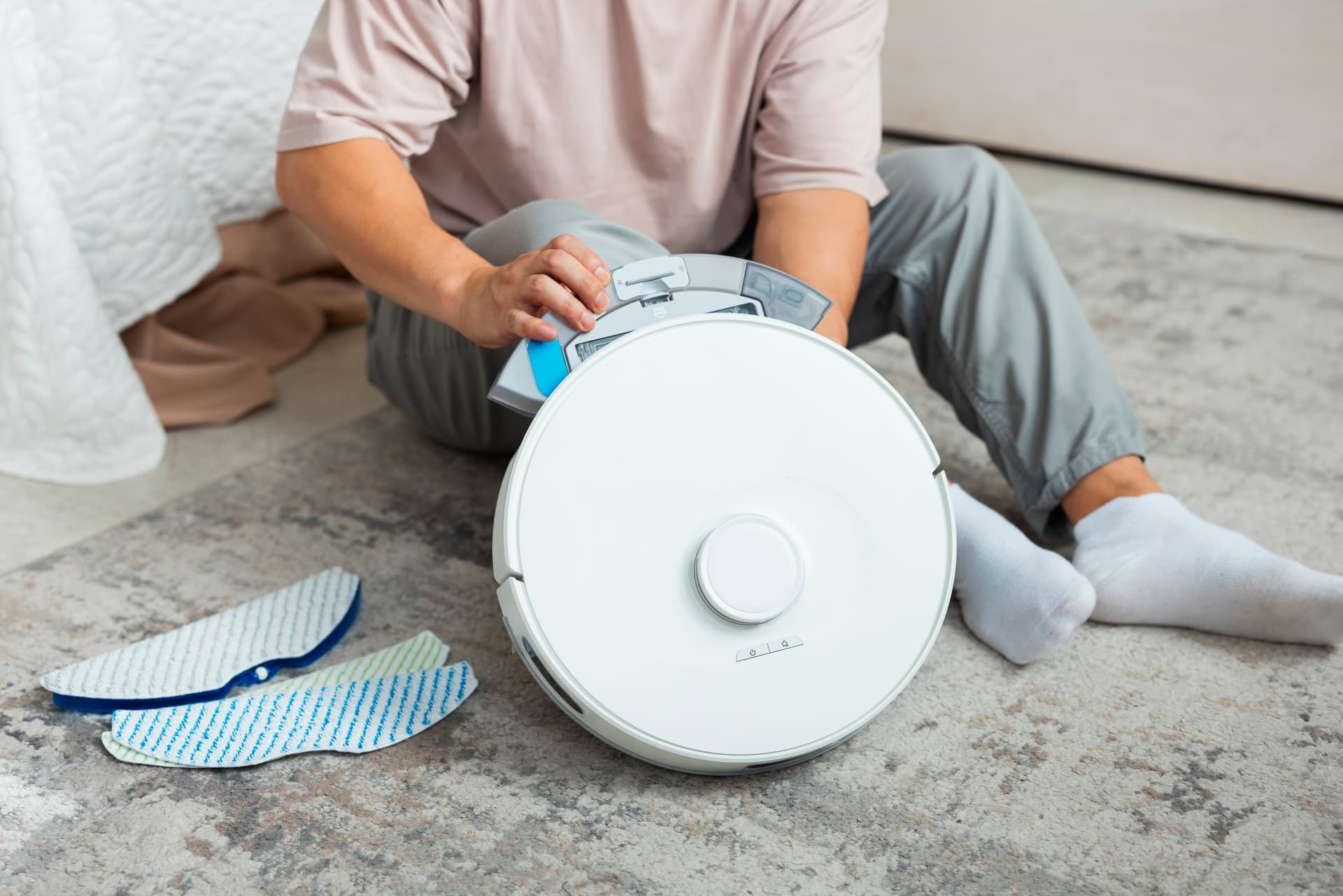 Woman with laptop in a sunny room — electronics protection in summer heat